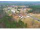A country home with a wooden deck sits on a large treed lot at 1912 Beach Ln, Heath Springs, SC 29058