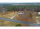 Aerial view of home with lush surrounding forest and large front yard at 1912 Beach Ln, Heath Springs, SC 29058