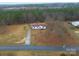 Aerial view of home with lush surrounding forest and large front yard at 1912 Beach Ln, Heath Springs, SC 29058