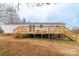 The backyard features a large deck and stairs to the yard at 1912 Beach Ln, Heath Springs, SC 29058