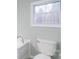 Bathroom with a toilet and corner sink at 1912 Beach Ln, Heath Springs, SC 29058