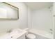 Bathroom with a shower/tub combo, toilet, single sink vanity and gold framed mirror at 1912 Beach Ln, Heath Springs, SC 29058