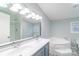 Bathroom with double sinks, a bathtub, and a walk-in shower at 1912 Beach Ln, Heath Springs, SC 29058
