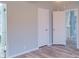 Light and bright bedroom with two closets and an open door to a bathroom at 1912 Beach Ln, Heath Springs, SC 29058