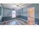 Bedroom featuring gray walls with white trim and natural light from a window at 1912 Beach Ln, Heath Springs, SC 29058