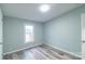 Bedroom with a neutral walls, a window, and wood-look flooring at 1912 Beach Ln, Heath Springs, SC 29058