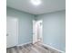 Bedroom with modern floors, paint and bright natural light coming from the windows at 1912 Beach Ln, Heath Springs, SC 29058