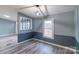 Cozy dining room featuring stylish flooring, wainscoting detail, and a modern light fixture for an inviting ambiance at 1912 Beach Ln, Heath Springs, SC 29058