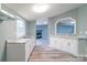 Kitchen featuring white cabinets and granite countertops with open view to Gathering room at 1912 Beach Ln, Heath Springs, SC 29058