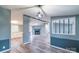 Open-concept living room with modern gray tones, a fireplace and updated flooring at 1912 Beach Ln, Heath Springs, SC 29058
