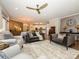 Open-concept living area showcasing elegant furnishings, hardwood floors, and a seamless flow to other spaces at 2006 Wesley Landing Rd, Waxhaw, NC 28173