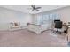 Bright bedroom with a plush couch, a desk, a bed, and natural lighting at 208 Cape August Pl, Belmont, NC 28012