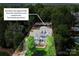 Beautiful two-story blue home with a spacious front yard and clearly marked boundary lines at 208 Cape August Pl, Belmont, NC 28012