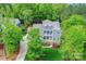 Beautiful blue two-story home with a well-manicured lawn and mature trees at 208 Cape August Pl, Belmont, NC 28012