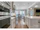 Spacious kitchen featuring a large island, modern appliances, and a view to the dining area at 208 Cape August Pl, Belmont, NC 28012