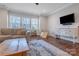 Inviting living room featuring comfortable seating, natural light from windows, and neutral decor, creating a relaxing atmosphere at 208 Cape August Pl, Belmont, NC 28012