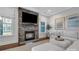 Cozy living room with a stone fireplace, and neutral decor, creating a relaxing atmosphere at 208 Cape August Pl, Belmont, NC 28012