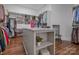 Spacious walk-in closet with custom shelving, providing ample storage and organization for clothing and accessories at 208 Cape August Pl, Belmont, NC 28012