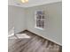 Bright bedroom with a large window letting in natural light and modern flooring at 215 Creek View Rd, Mooresville, NC 28117