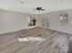 Open living space featuring a ceiling fan, modern floors, and direct access to the kitchen at 215 Creek View Rd, Mooresville, NC 28117