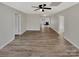Spacious open floor plan living room with abundant natural light and modern flooring at 215 Creek View Rd, Mooresville, NC 28117