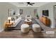 Bright living room featuring modern furniture, a striped rug, and plenty of natural light from the windows at 215 Creek View Rd, Mooresville, NC 28117