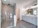Modern bathroom with a large glass shower and double sink vanity at 2511 Dundeen St, Charlotte, NC 28216