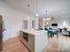 Spacious kitchen featuring a large island and an open design that flows seamlessly into the living and dining areas at 2511 Dundeen St, Charlotte, NC 28216