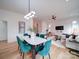 Spacious open-concept layout featuring a modern living area, dining space, and staircase at 2511 Dundeen St, Charlotte, NC 28216