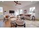 Cozy living room with neutral tones, large windows, and hardwood flooring exudes comfort and style at 2511 Dundeen St, Charlotte, NC 28216