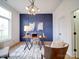 Stylish home office features a modern light fixture and elegant wainscoting at 2511 Dundeen St, Charlotte, NC 28216