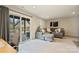 Cozy living room featuring a gray sectional sofa, neutral carpet, and sliding glass doors to the outdoor space at 2536 Grantham Place Dr, Fort Mill, SC 29715