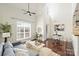 Bright living room featuring vaulted ceiling, large window, modern decor, and hardwood flooring at 301 E Tremont Ave # 314, Charlotte, NC 28203