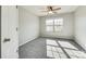 Sunlit bedroom with plush carpet and a large window at 311 Kennebel Pl, Fort Mill, SC 29715