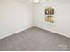 Bedroom with carpet flooring, neutral walls, bright window, and ample space at 3161 Glen Robin Ct, Charlotte, NC 28205
