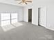 Bedroom with carpet, natural light, ceiling fan, and ample space at 3161 Glen Robin Ct, Charlotte, NC 28205
