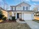 Charming two-story home featuring a well-manicured lawn, inviting entrance, and attached garage at 3161 Glen Robin Ct, Charlotte, NC 28205