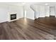 Spacious living room with fireplace, ceiling fan, recessed lights, and luxury vinyl plank flooring at 3161 Glen Robin Ct, Charlotte, NC 28205