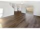 Bright open-concept living area with luxury vinyl plank flooring and sliding glass doors to the patio at 3161 Glen Robin Ct, Charlotte, NC 28205