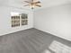 Bright main bedroom features a large window, plush gray carpet, and neutral paint at 3161 Glen Robin Ct, Charlotte, NC 28205