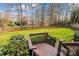 Expansive backyard features a lush lawn, wooden fence, and mature trees at 3536 Wylie Meadow Ln, Charlotte, NC 28269