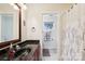 Bathroom with large mirror, granite countertop, vanity, and curtained shower at 3536 Wylie Meadow Ln, Charlotte, NC 28269