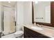 Well-lit bathroom with a glass shower and a dark wood vanity with a light countertop at 3536 Wylie Meadow Ln, Charlotte, NC 28269