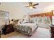 Cozy bedroom featuring a ceiling fan, large window with view, and comfortable furnishings at 3536 Wylie Meadow Ln, Charlotte, NC 28269