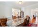 Traditional dining room with hardwood floors, a patterned rug, and space for Gathering gatherings at 3536 Wylie Meadow Ln, Charlotte, NC 28269