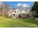 Charming brick home with manicured lawn and mature landscaping at 3536 Wylie Meadow Ln, Charlotte, NC 28269