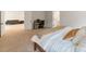 Bright, carpeted bedroom featuring an office space, living room, and a glimpse into the ensuite bathroom at 4159 Millstream Rd, Denver, NC 28037