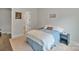 Cozy bedroom with neutral colors, a comfortable bed, and minimalist decor at 4159 Millstream Rd, Denver, NC 28037
