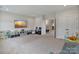 Spacious bonus room featuring a TV, play area, and ample space for entertaining at 4159 Millstream Rd, Denver, NC 28037