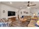 Comfortable living room with ceiling fan, modern furnishings, and luxury vinyl plank flooring at 4769 Darcey Way, Indian Land, SC 29707